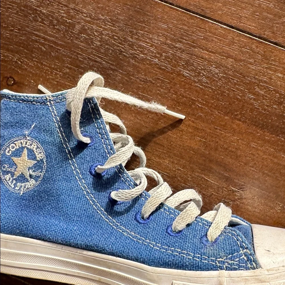 Size 2 Converse Chuck Taylor All Star Sneakers on blue